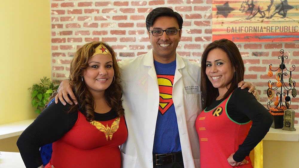 Dr. Paresh N Varu, MD and two nurses dressed as super heros.